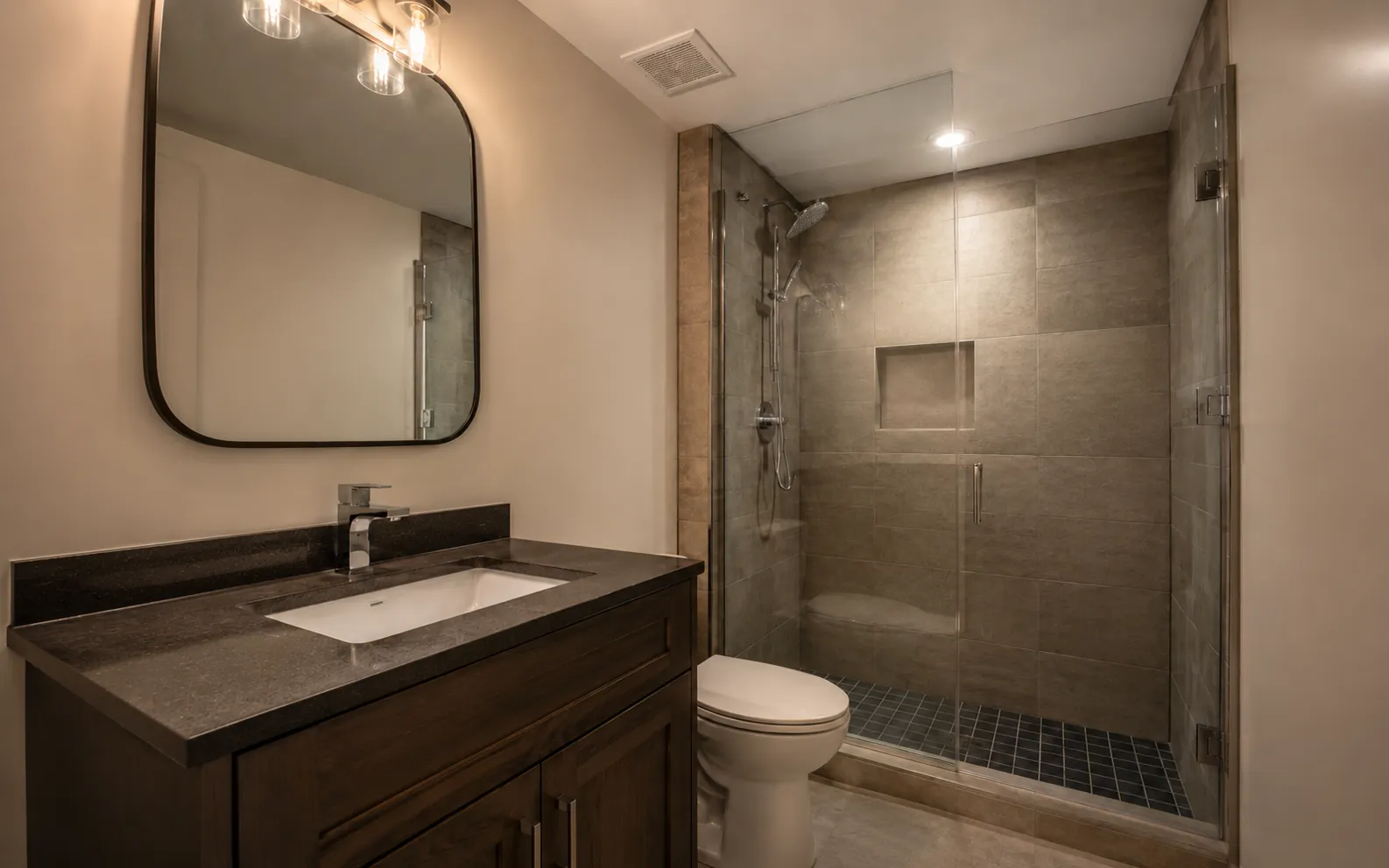 Modern Ottawa basement bathroom with minimalist design, walk-in shower, and code-compliant ventilation
